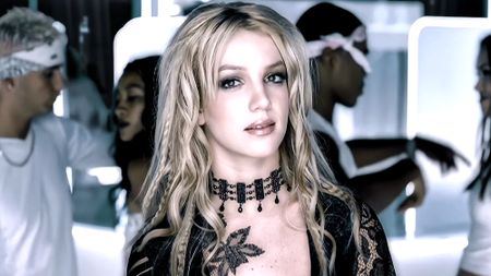 Britney in a lace black floral top and choker in the Stronger music video 2000.
