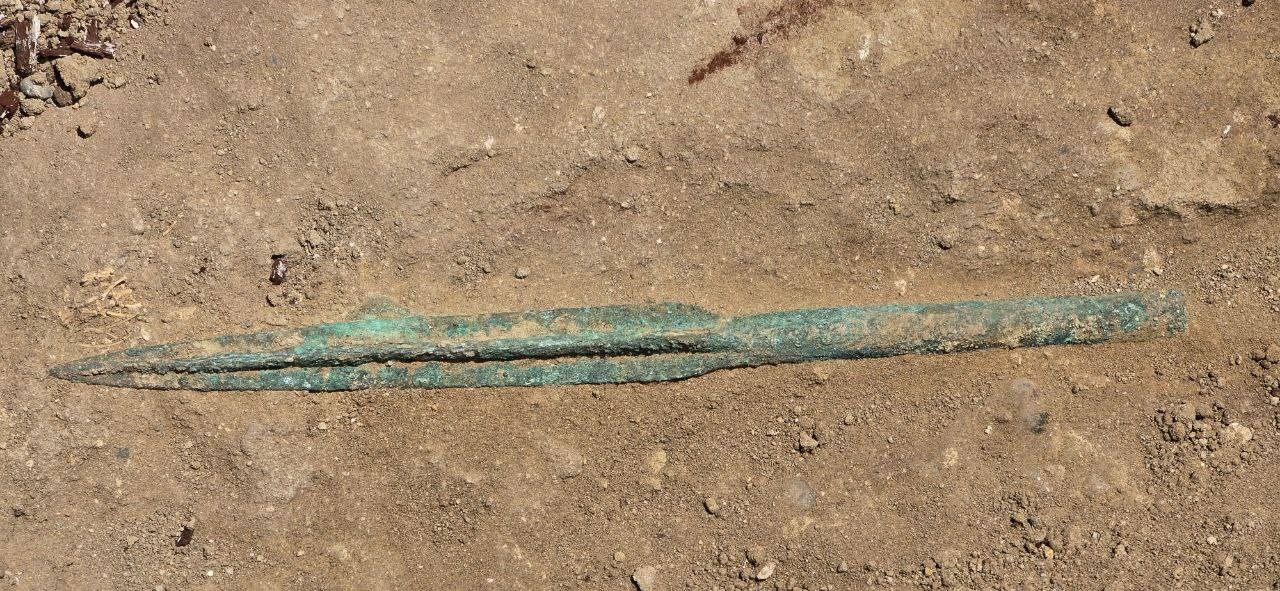 a spearhead in the dirt