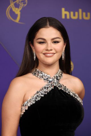 Selena Gomez attends the 76th Primetime Emmy Awards at Peacock Theater on September 15, 2024 in Los Angeles, California wearing a black mermaid dress