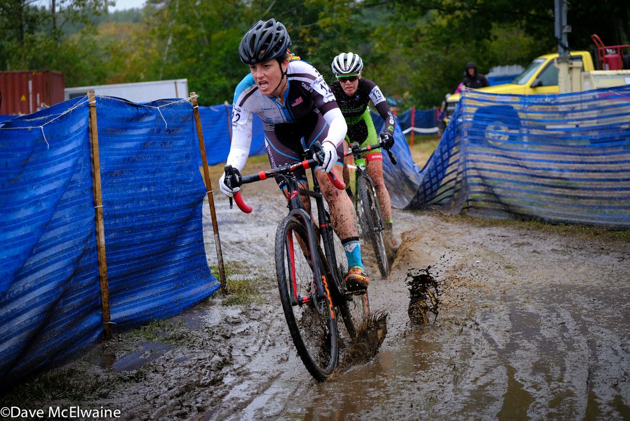Jenna Greaser (Women's Project Pedal) riding through one of the many muddy sections of the course