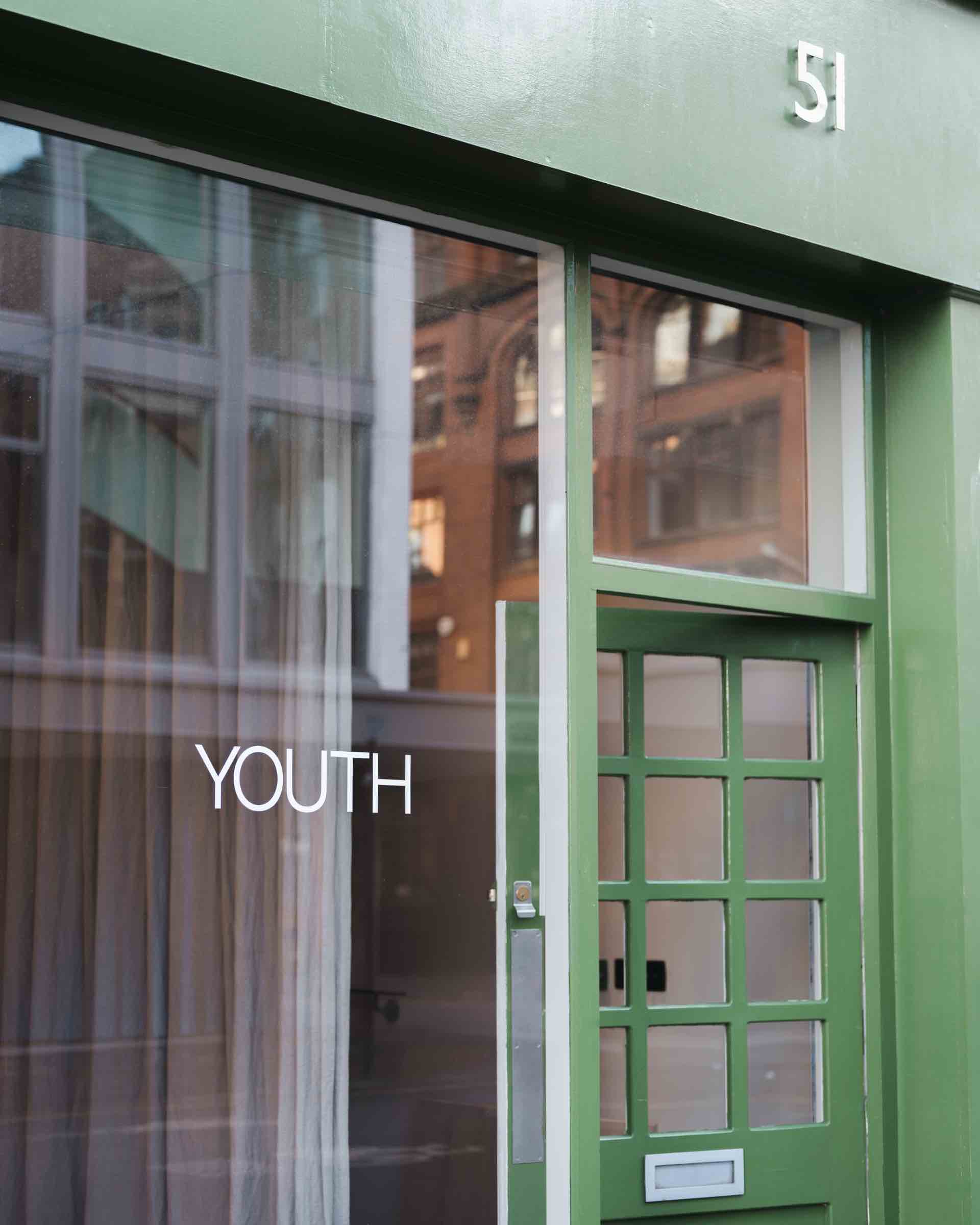 Green-painted glazed office facade