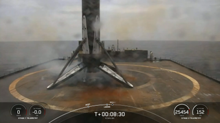 a rocket lands on a floating barge at sea