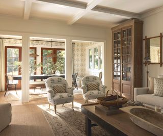 living room with view to dining space and soft neutral colors and wooden floors