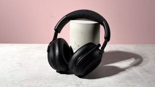The Final VR3000 EX for Gaming unfolded and leant against a stone and concrete cylinder.