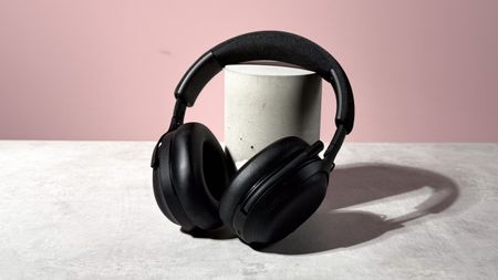 The Final VR3000 EX for Gaming unfolded and leant against a stone and concrete cylinder.