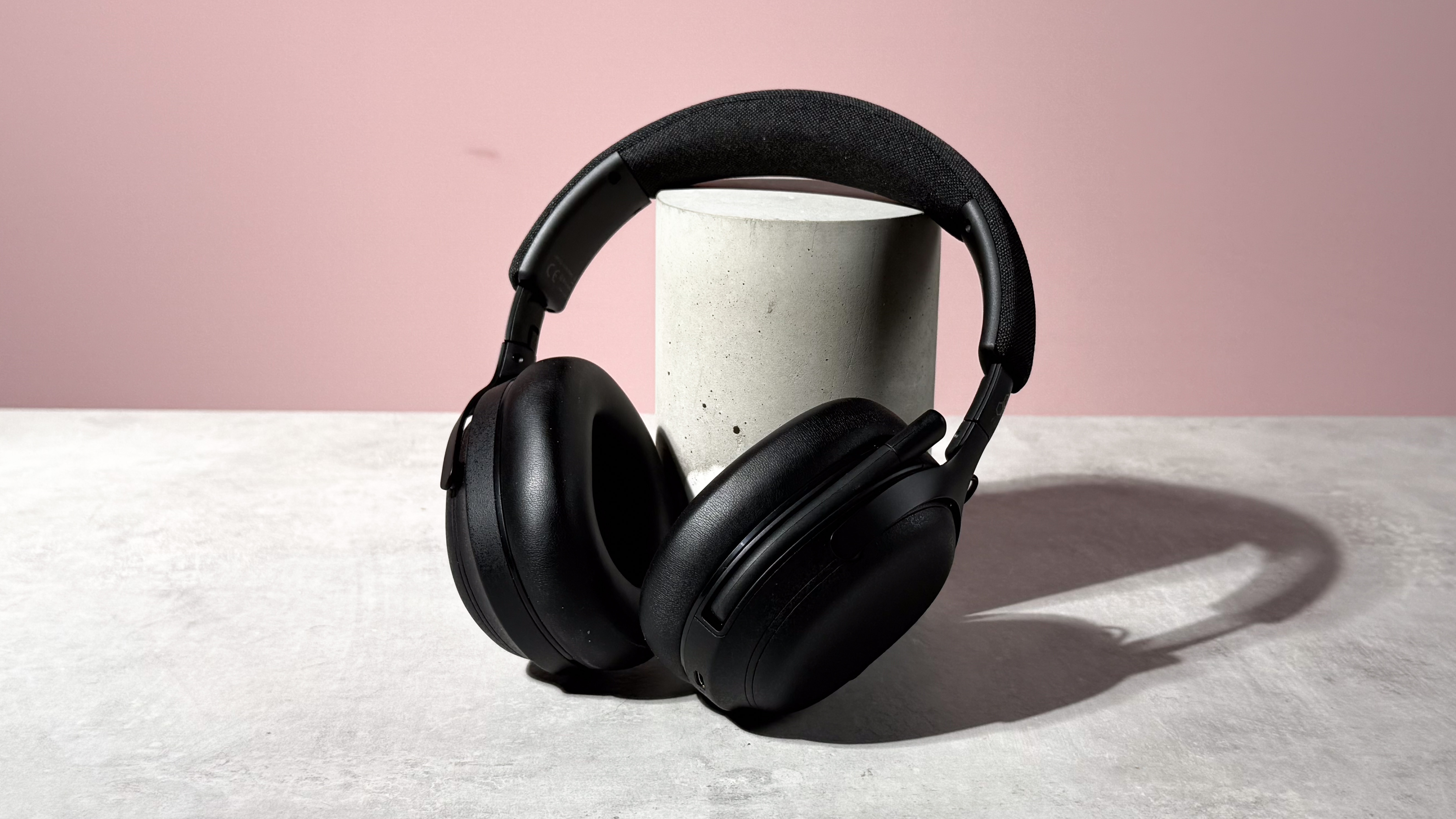 The Final VR3000 EX for Gaming unfolded and leant against a stone and concrete cylinder.