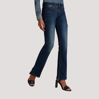 Flat lay image of woman wearing flared jeans