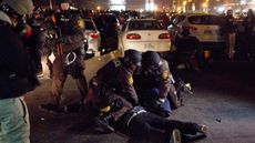 Police make an arrest during a protest in Ferguson