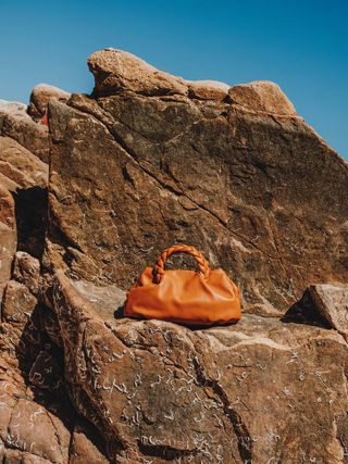 Coloured bag sitting on rocks