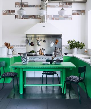 Primary green base units, industrial style kitchen, painted table, chrome elements,