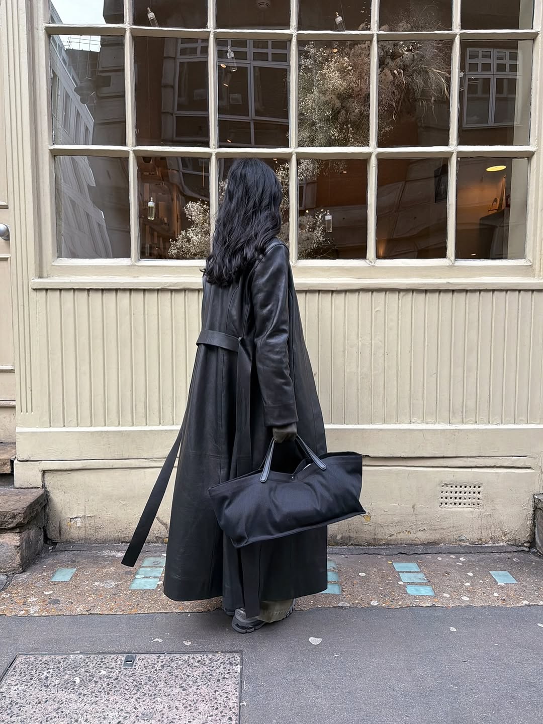 woman wearing leather trench coat jean outfit spring 2026