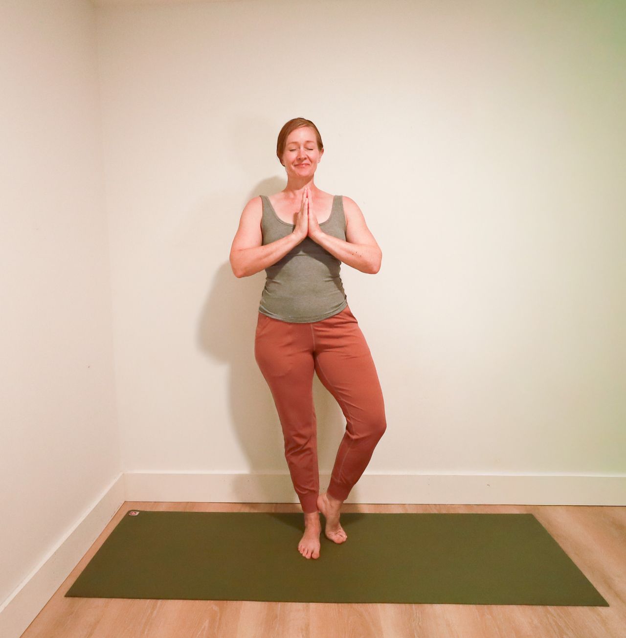 Woman demonstrates yoga pose