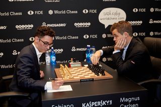 Magnus Carlsen, the reigning World Chess Champion (right) and Fabiano Caruana, U.S. Challenger during Round 1 of the FIDE World Chess Championship Match on Nov. 9, 2018 in London. 