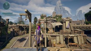 Screenshot of Avowed on PC showing a player character standing in front of the entrance to a city.