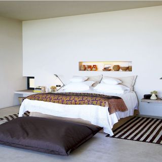 bedroom with bed and white walls
