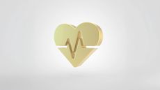 Golden heart beat symbol isolated on white background