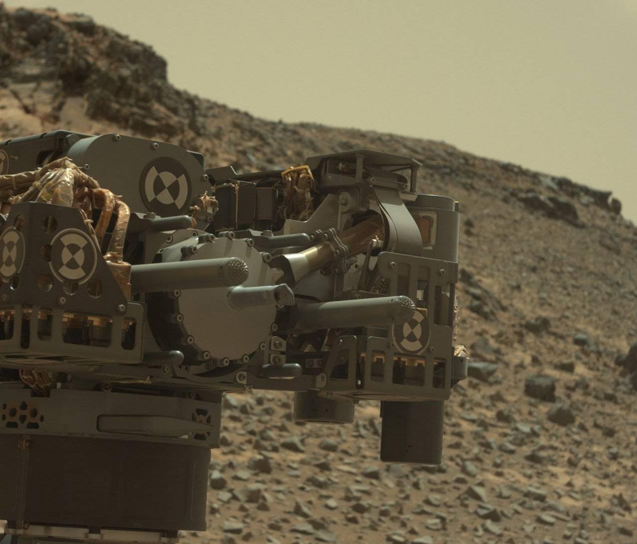 This raw-color image captured by the Mars rover Curiosity&#039;s Mastcam shows the robot&#039;s drill just after finishing a drilling operation at an outcrop called Telegraph Peak on Feb. 24, 2015.