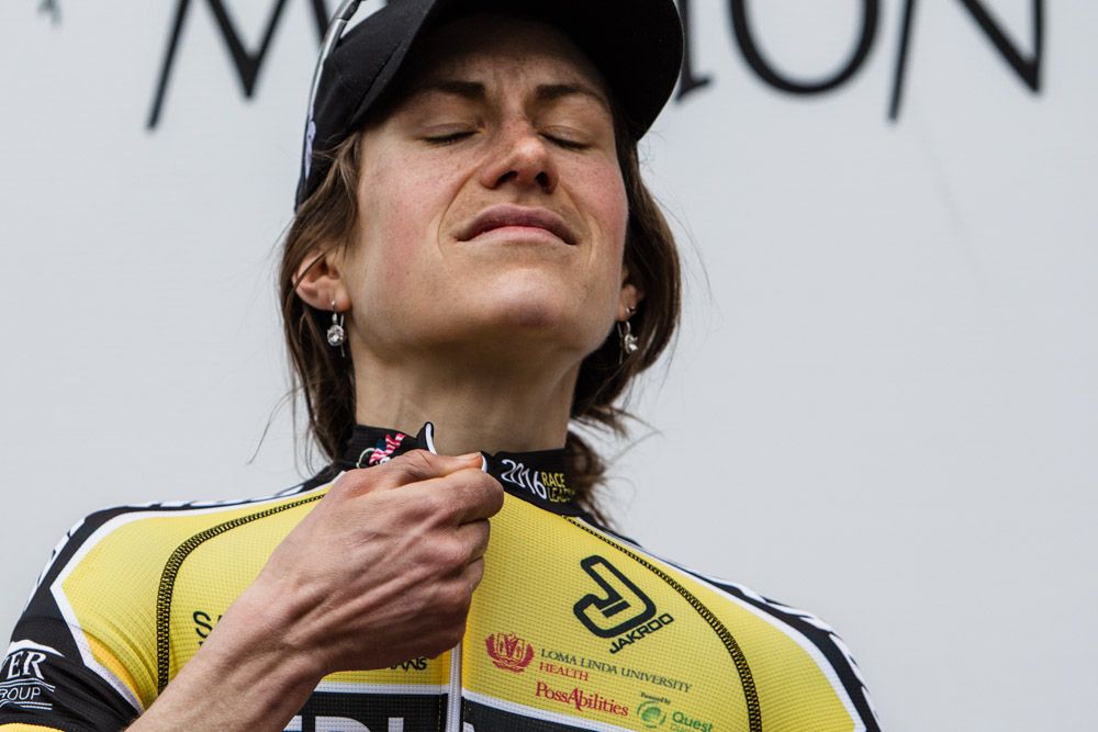 Mara Abbott (Amy D Foundation) shows the pain from the day on the podium
