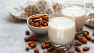image shows a glass of almond milk
