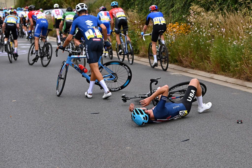 LEUVEN BELGIUM SEPTEMBER 24 Sean Quinn of The United States involved in a crash during the 94th UCI Road World Championships 2021 Men U23 Road Race a 1609km race from Antwerp to Leuven flanders2021 on September 24 2021 in Leuven Belgium Photo by Dirk Waem PoolGetty Images