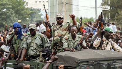 Protesters greet soldiers in the Malian capital Bamako