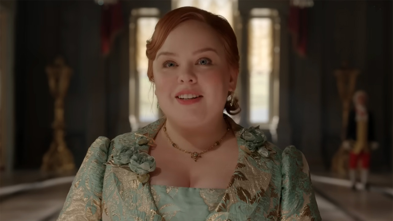 Penelope actress Nicola Coughlan speaks to the court in a blue dress in Bridgerton Season 4.