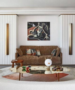 neutral living room with maximalist art and decor pieces