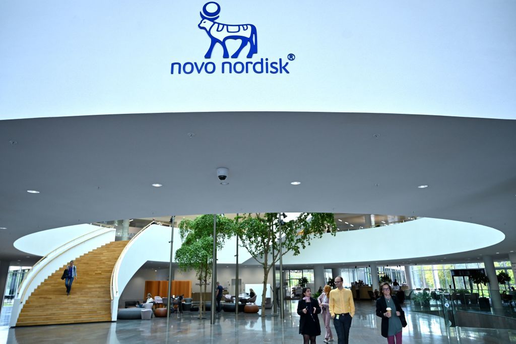 People walk inside the Novo Nordisk headquarters in Bagsvaerd 