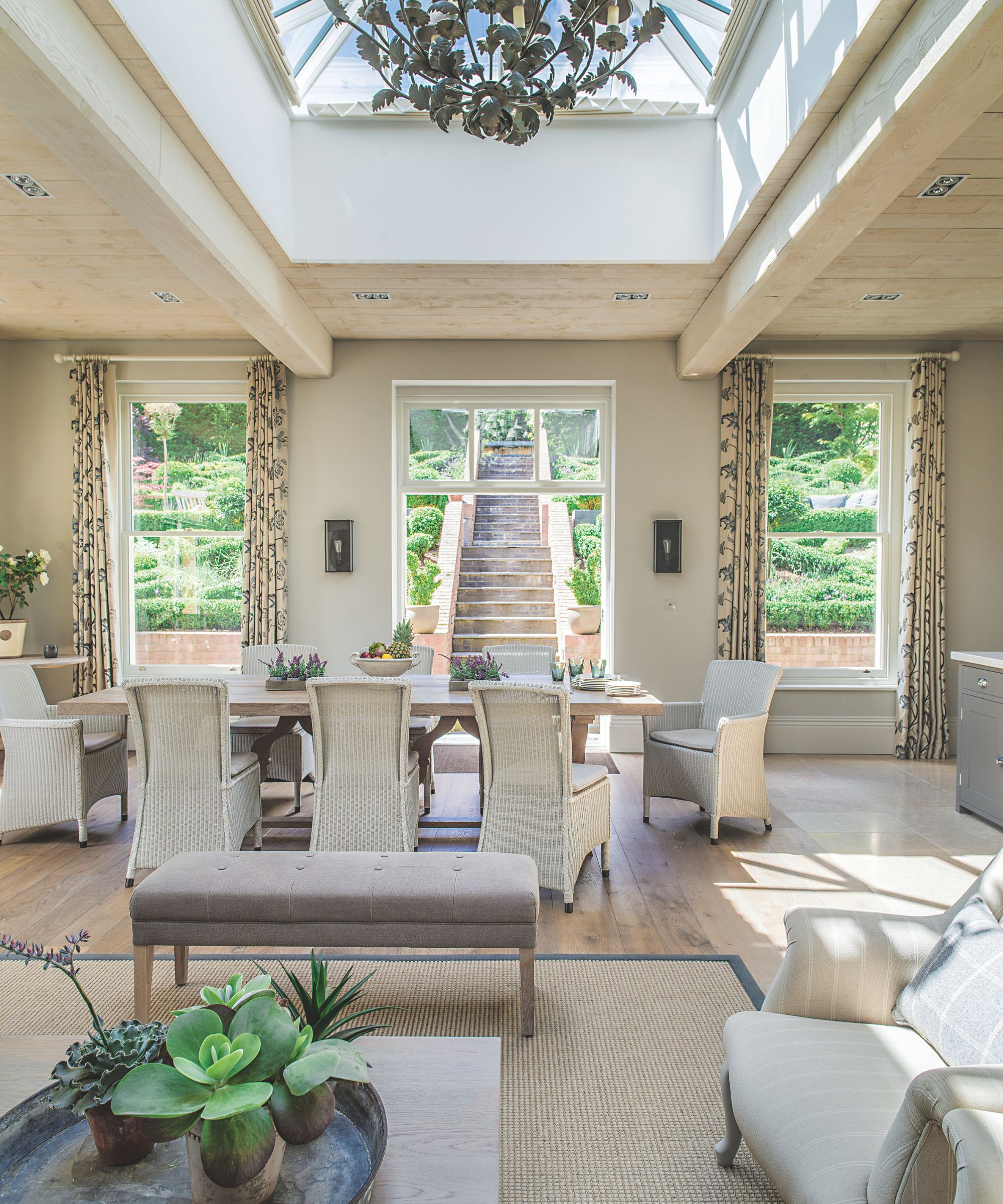 Neutral living room with dining area leading onto a garden
