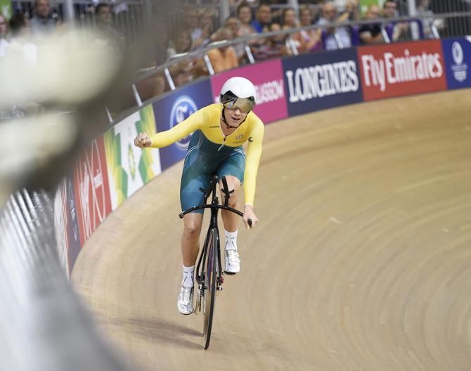 Any Cure celebrates her bronze medal performance