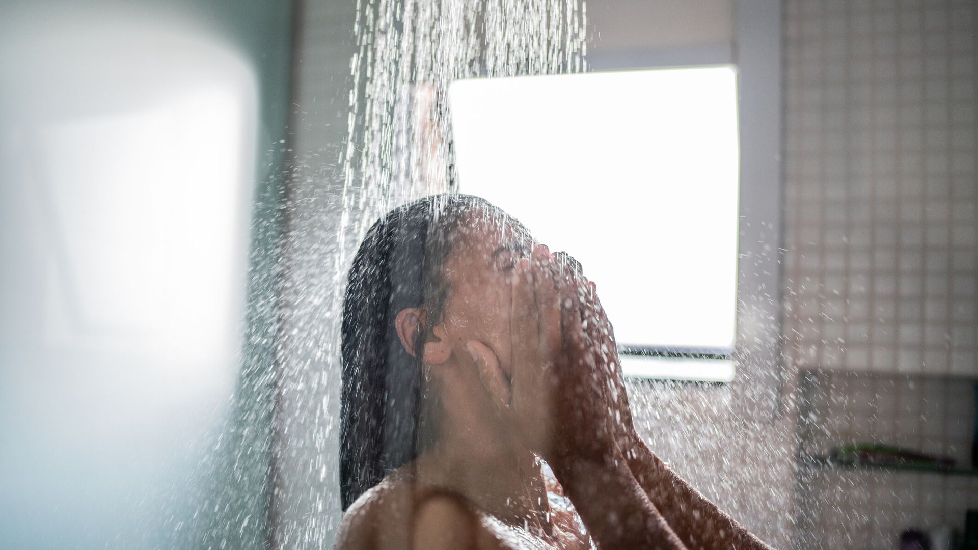 Woman showering before bed