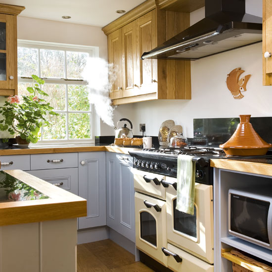 kitchen with wooden flooring and white cabinet