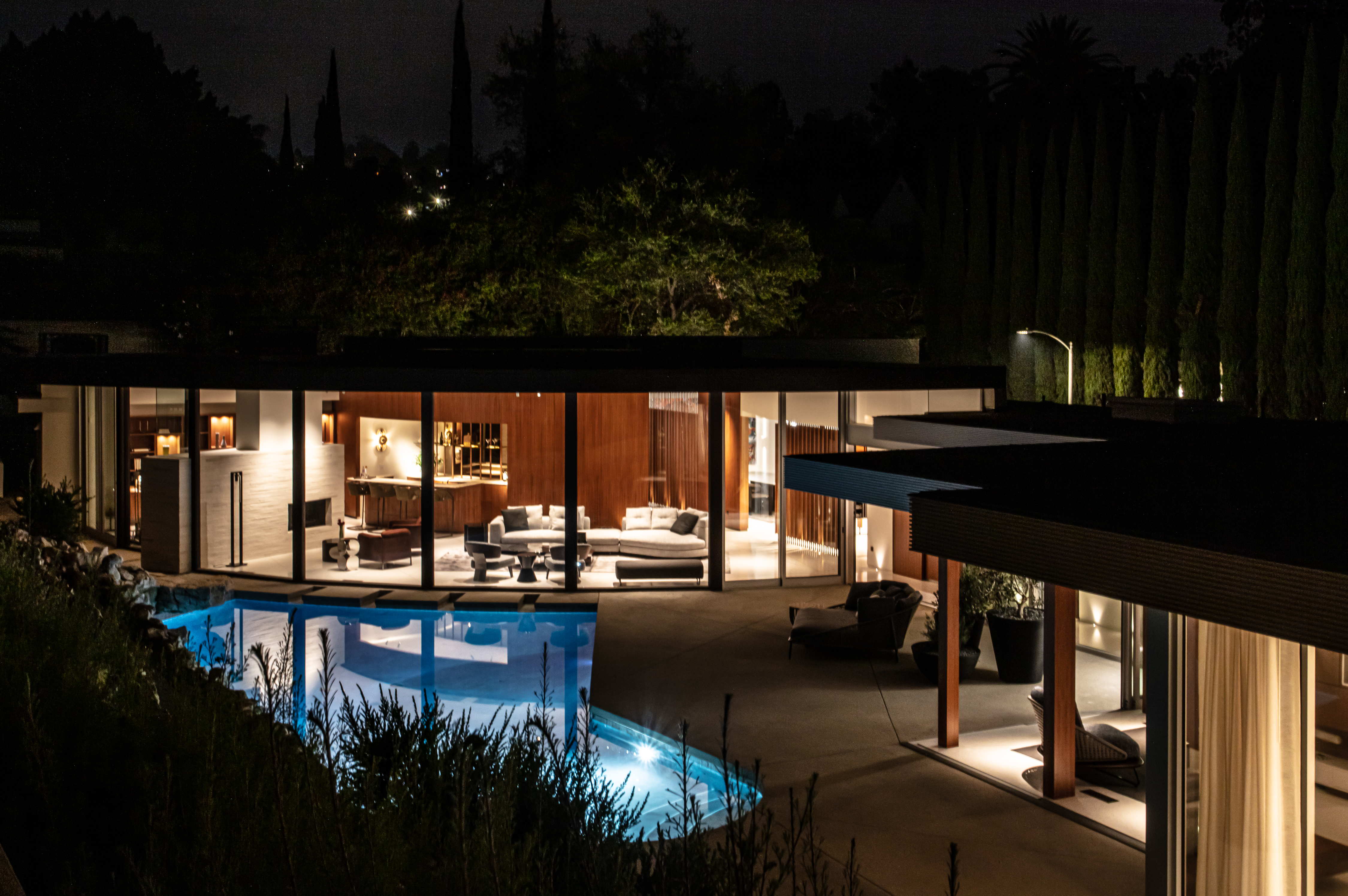 exterior view at night of cove way, a midcentury home restored by Sophie goineau