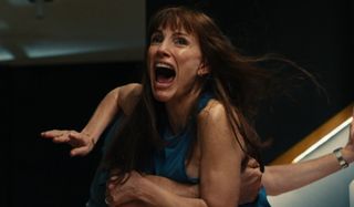 Jessica Chastain screaming while someone holds onto her in Other Mommy