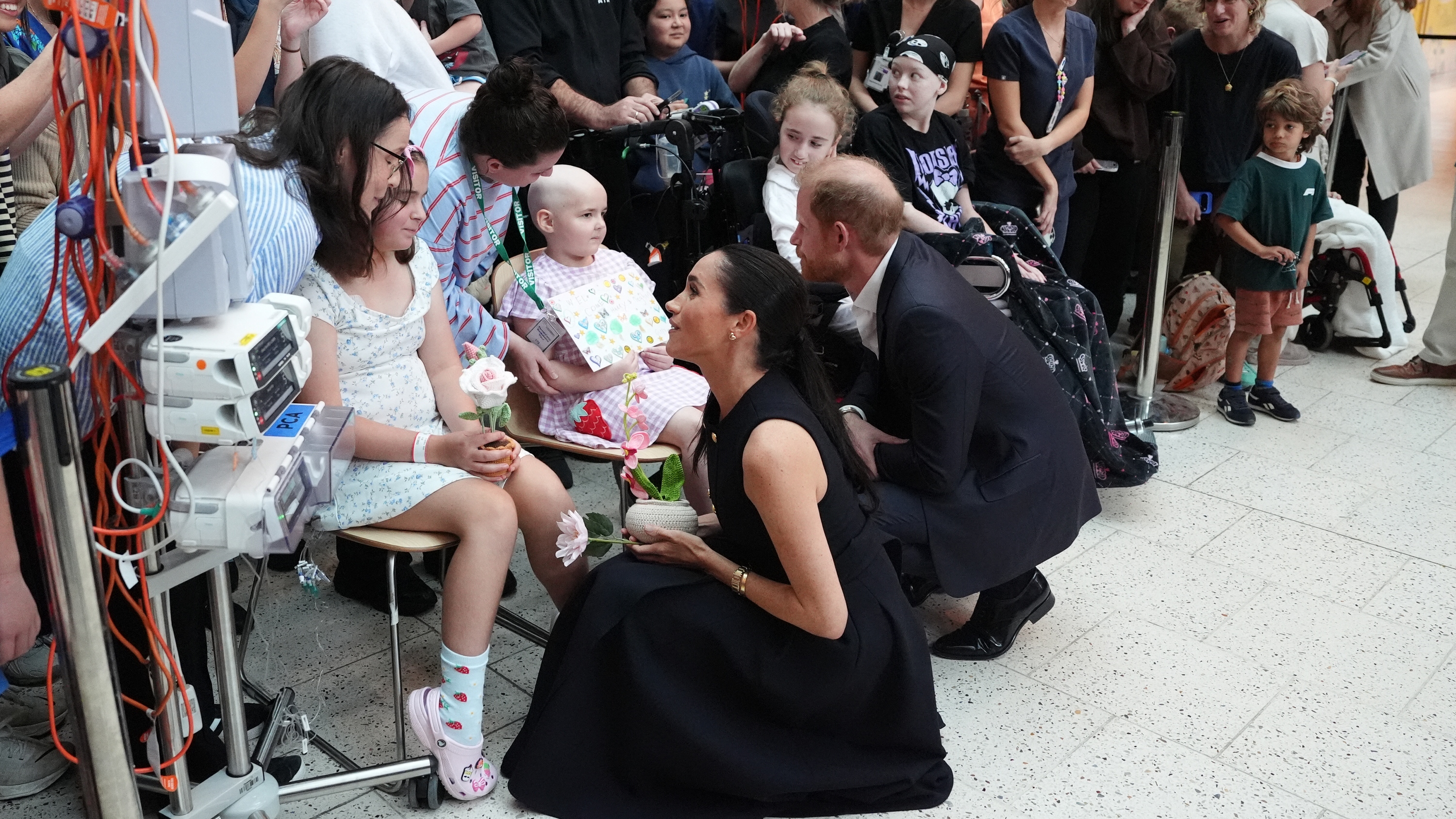 Prince Harry and Meghan, Duchess of Sussex, meet patients and their families during a visit at the Royal Children's Hospital in Melbourne on April 14, 2026