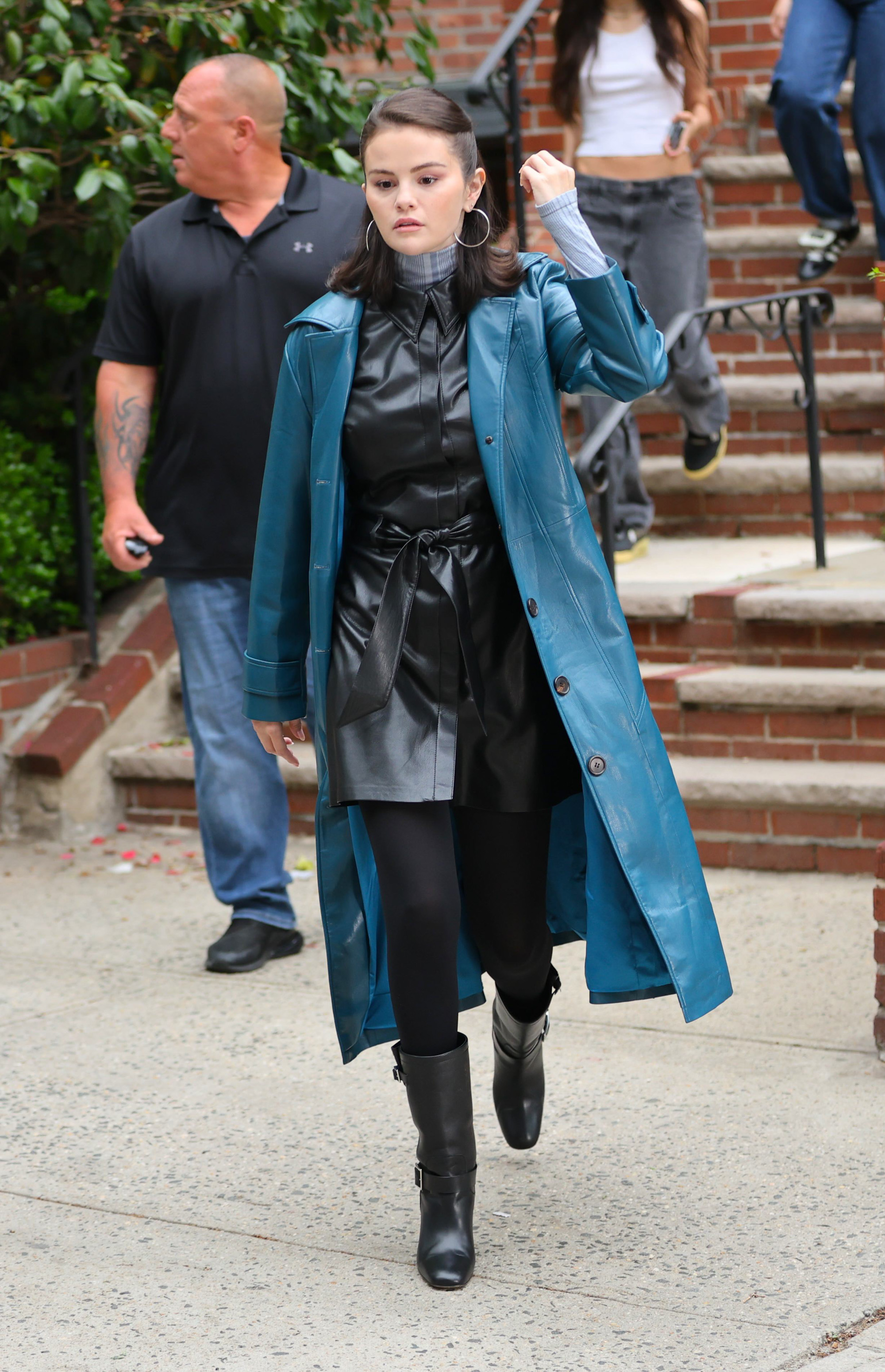 Selena Gomez wears a blue leather coat on the set of 'Only Murders In The Building.'