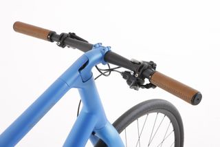 The integrated stem is really neat and the custom leather grips really compliment the frame