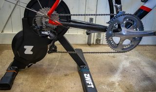 A bike mounted to a Zwift smart trainer showing a clean Shimano drive train