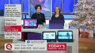 Two presenters on the QVC channel selling HP laptops