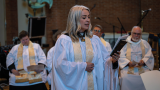 Reverend Emily Kolltveit singing a hymn