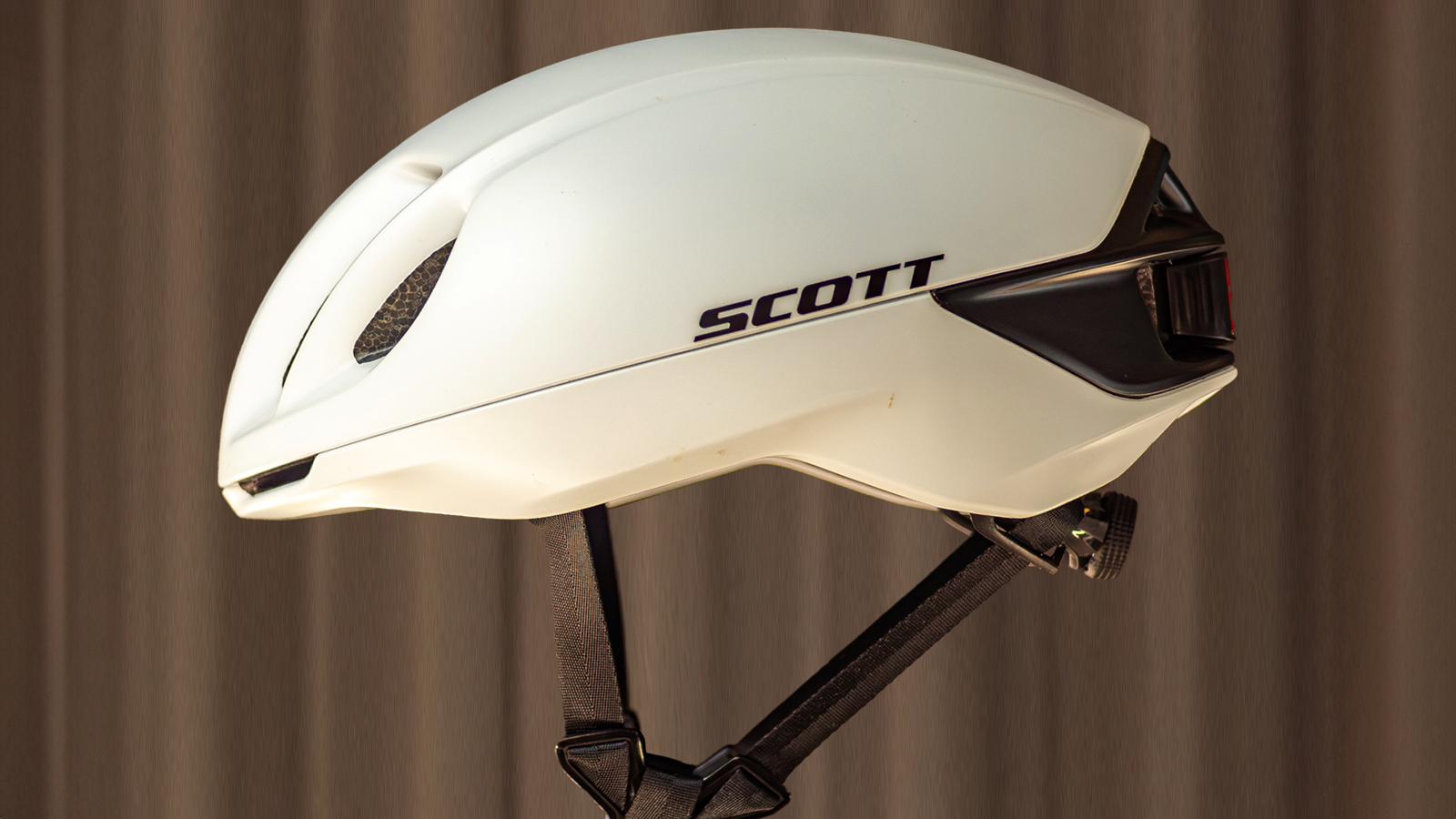 A white Scott Cadence Plus Helmet on a plain background