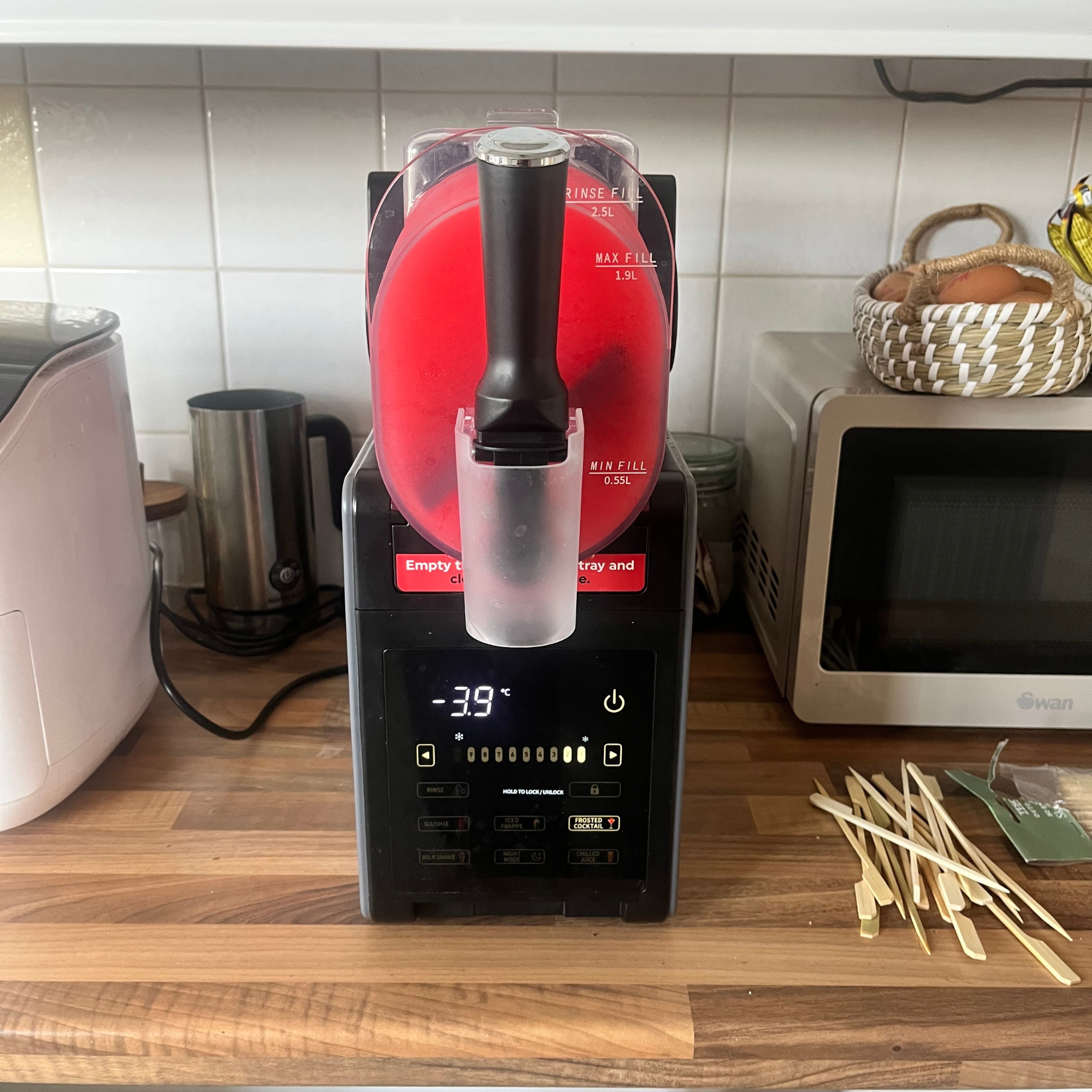 Salter Slushie Machine on Kicthen worktop making raspberry slush.
