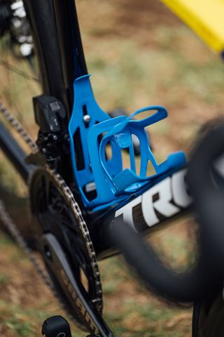 Blue bottles cages mounted to a Trek Madone bike