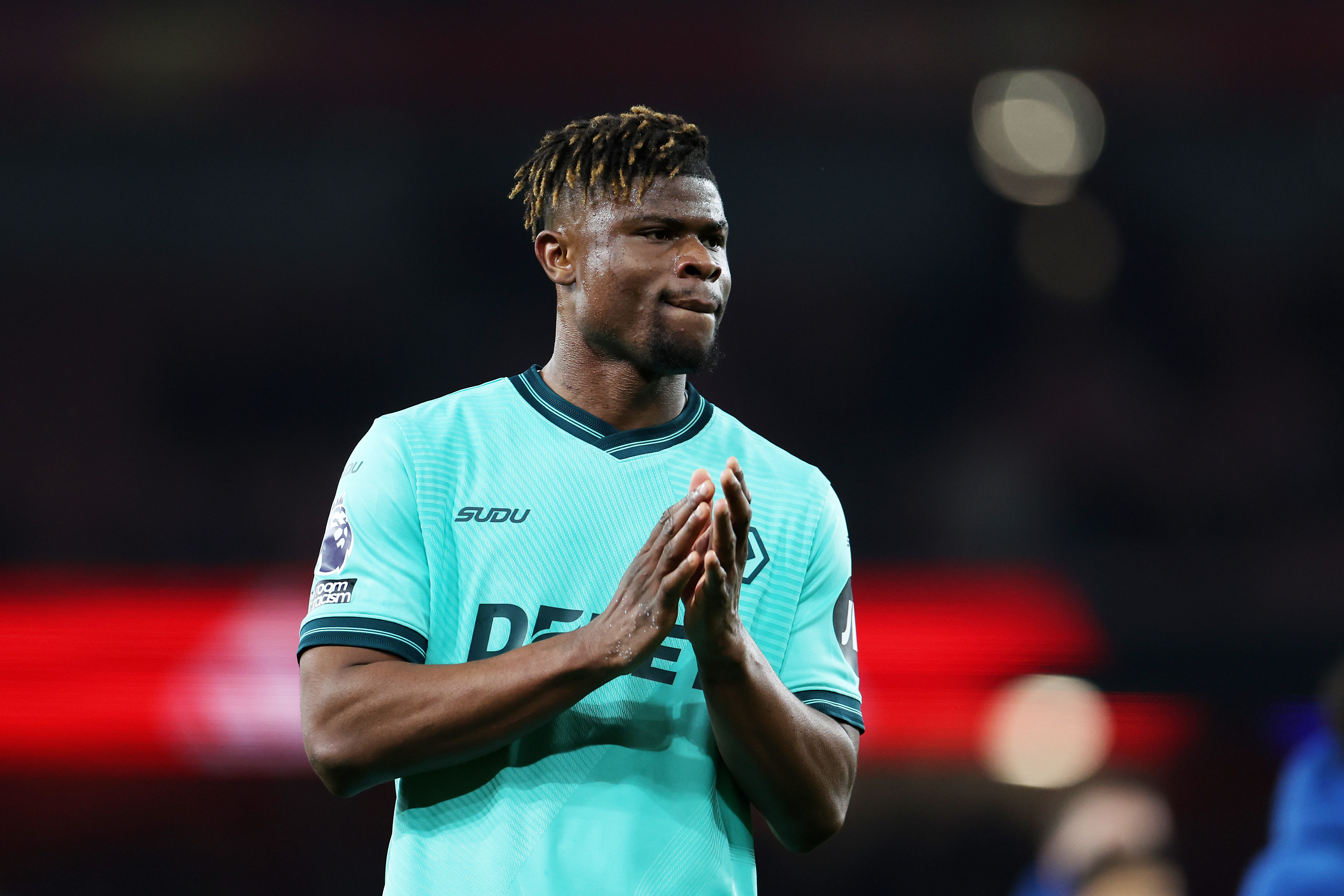 LONDON, ENGLAND - DECEMBER 13: Emmanuel Agbadou of Wolverhampton Wanderers applauds the fans following the Premier League match between Arsenal and Wolverhampton Wanderers at Emirates Stadium on December 13, 2025 in London, England. (Photo by Brett Patzke - WWFC/Wolves via Getty Images)