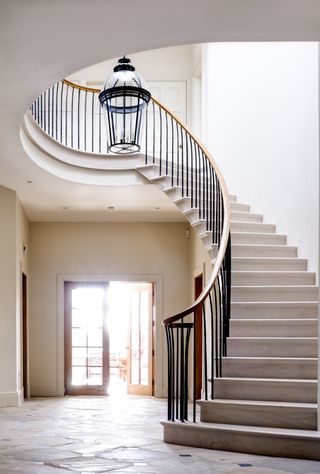 period style staircase in light coloured stone