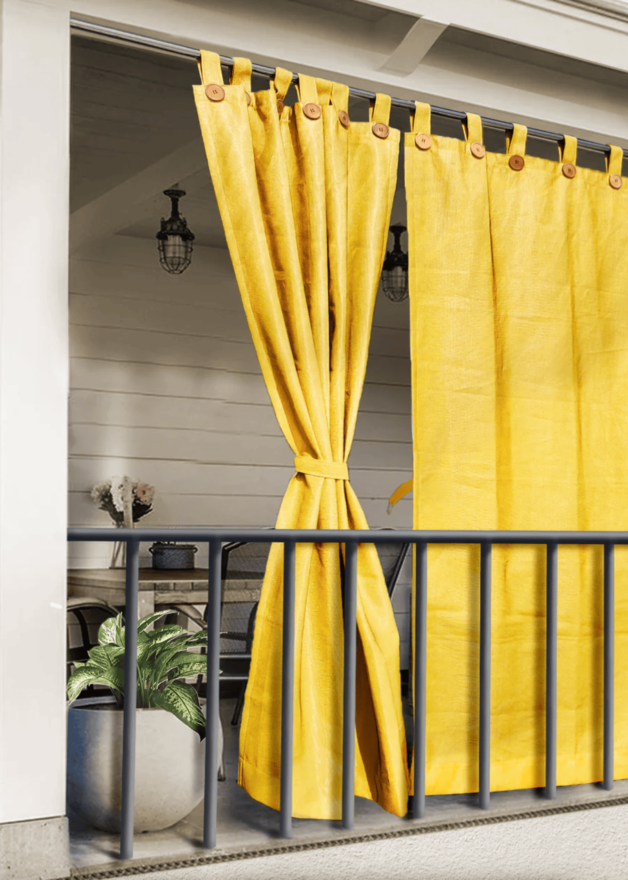 yellow outdoor curtains with loop fixings hanging on a balcony for shade