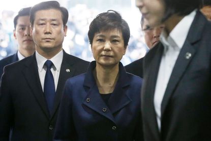 Ousted South Korean president Park Guen-hye is escorted to jail