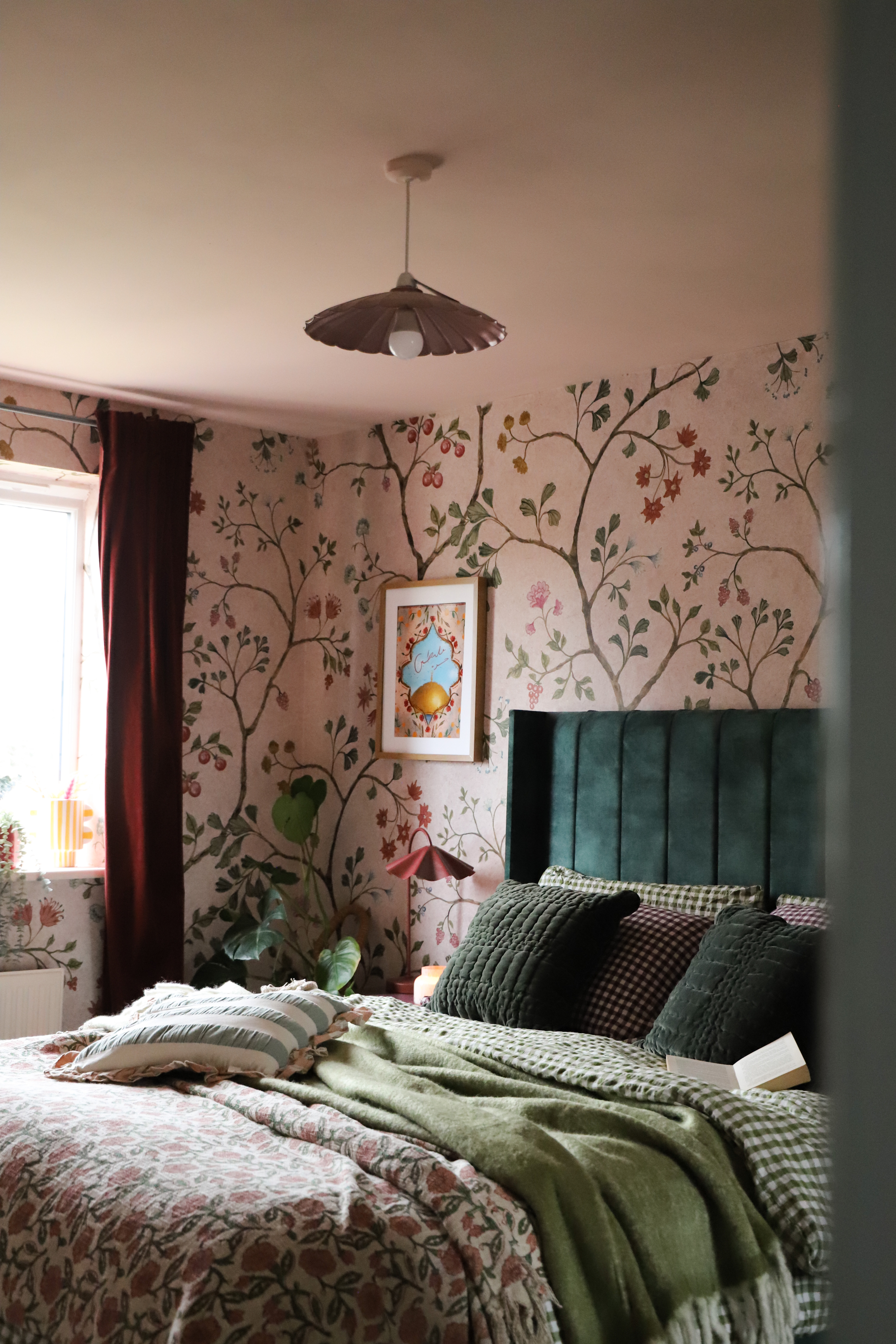 Richly layered interiors and exteriors shots of environments decorated with contrasting patterns, plush textiles, framed original artwork, pastel palettes, and plenty of natural light.