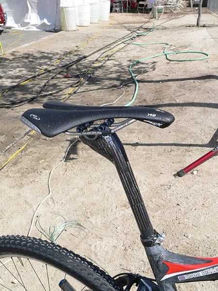 An AX-Lightness post is adapted for use in the S-Works Epic Carbon with a custom-made carbon fiber shim.