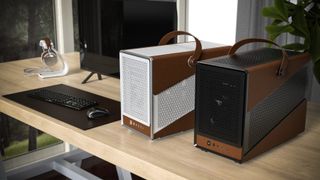 Two SFF PCs on a table, using the Montech Heritage leather PC case.